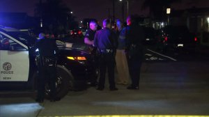 Los Angeles Police officials investigate a triple shooting in Wilmington on Nov. 28, 2016. (Credit: KTLA)