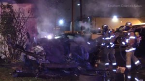Firefighters look over the mangled remains of a double fatal crash in Anaheim on Dec. 10, 2016. (Credit: Southern Counties News)