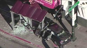 Ten people were hurt, including five with major injuries, after a car plowed into a bus stop in San Francisco on Dec. 16, 2016. (Credit: KPIX)