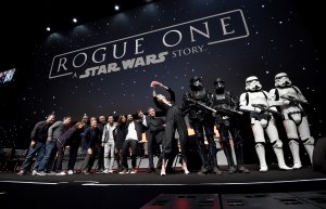 Forest Whitaker, Mads Mikkelsen, Alan Tudyk, Wen Jiang, Donnie Yen, Felicity Jones, Riz Ahmed, Diego Luna, Ben Mendelsohn and Gwendoline Christie take a selfie on stage during the "Rogue One" Panel at the Star Wars Celebration 2016 at ExCel on July 15, 2016, in London, England. (Credit: Ben A. Pruchnie/Getty Images for Walt Disney Studios)