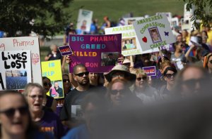 WASHINGTON, DC - SEPTEMBER 18: Activists and family members of loved ones who died in the opioid/heroin epidemic march in a "Fed Up!" rally at Capitol Hill on September 18, 2016 in Washington, DC. Protesters called on legistlators to provide funding for the Comprehensive Addiction and Recovery Act, which Congress passed in July without funding. Some 30,000 Americans die each year due to heroin and painkiller pill addiciton in the United States. (Photo by John Moore/Getty Images)