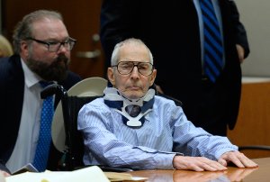 Attorney Chip Lewis is seated close behind New York real estate heir Robert Durst, at the Airport Branch of the Los Angeles County Superior Court on Nov. 7, 2016 for his trial in which he’s pleaded not guilty to the December 2000 murder of his friend Susan Berman. (Credit: Kevork Djansezianv / AFP / Getty Images)