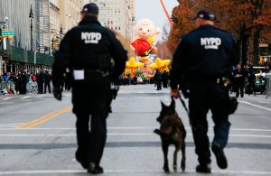 NYPD officers patrol the street as people arrive to watch the 90th Macy's Annual Thanksgiving Day Parade on November 24, 2016 in New York City. (Credit: Eduardo Munoz Alvarez/Getty Images)