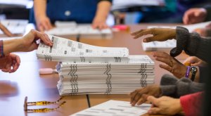 Tabulators work on recounting presidential ballots in Dane County on Dec. 1, 2016, in Madison, Wisconsin. (Credit: Andy Manis / Getty Images)