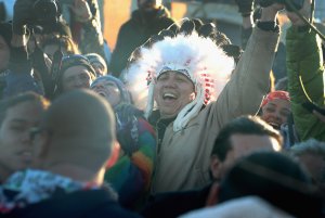 Native American and other activists celebrate after learning an easement had been denied for the Dakota Access Pipeline at Oceti Sakowin Camp on the edge of the Standing Rock Sioux Reservation on December 4, 2016 outside Cannon Ball, North Dakota. (Credit: Scott Olson/Getty Images)