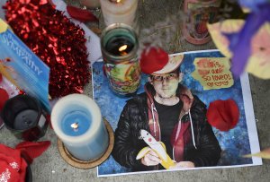 A photo of a victim is seen at a makeshift memorial on Dec. 5, 2016, in Oakland, near the site where a fire at a warehouse killed at least 36 people. (Credit: JOSH EDELSON/AFP/Getty Images)