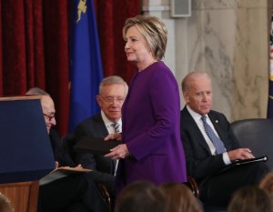 Former U.S. Secretary of State Hillary Clinton is introduced to speak during a portrait unveiling ceremony for outgoing Senate Minority Leader Harry Reid (D-NV), on Capitol Hill Dec. 8, 2016. (Credit: Mark Wilson/Getty Images)