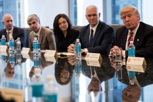 Jeff Bezos, chief executive officer of Amazon, Larry Page, chief executive officer of Google's parent company Alphabet Inc., Sheryl Sandberg, chief operating officer of Facebook, and Vice President-elect Mike Pence listen as President-elect Donald Trump speaks during a meeting of technology executives at Trump Tower, Dec. 14, 2016, in New York City. (Credit: Drew Angerer/Getty Images)