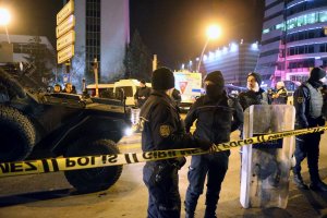 Turkish soldiers and policemen stand guard near the Cagdas Sanatlar Merkezi, a major art exhibition hall, where Andrey Karlov, the Russian ambassador to Ankara, has been shot dead on Dec. 19, 2016, in a gun attack during an art exhibition in Ankara. (Credit: ADEM ALTAN/AFP/Getty Images)