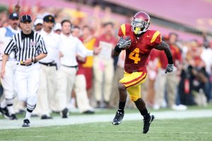 Joe McKnight, No. 4 of the USC Trojans, rushes the ball during a game at the Los Angeles Memorial Coliseum against the Ohio State Buckeyes on Sept. 13, 2008 in Los Angeles. (Credit: Harry How/Getty Images)