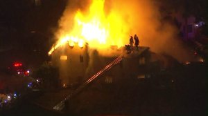 Fire crews battle a fire in Glendale on Dec. 19, 2016. (Credit: KTLA)