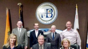 Michael Hoskinson, rear right, poses with the Huntington Beach Planning Commission in a photo on the city's website.