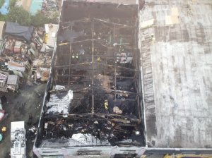 The burnt shell of an artists' warehouse where a massive fatal fire occurred in Oakland is shown on Dec. 5, 2016. (Credit: KTLA)