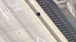 A suspicion item tossed onto the 210 Freeway in Pasadena prompted the partial closure of the roadway on Dec. 7, 2016. (Credit: KTLA)