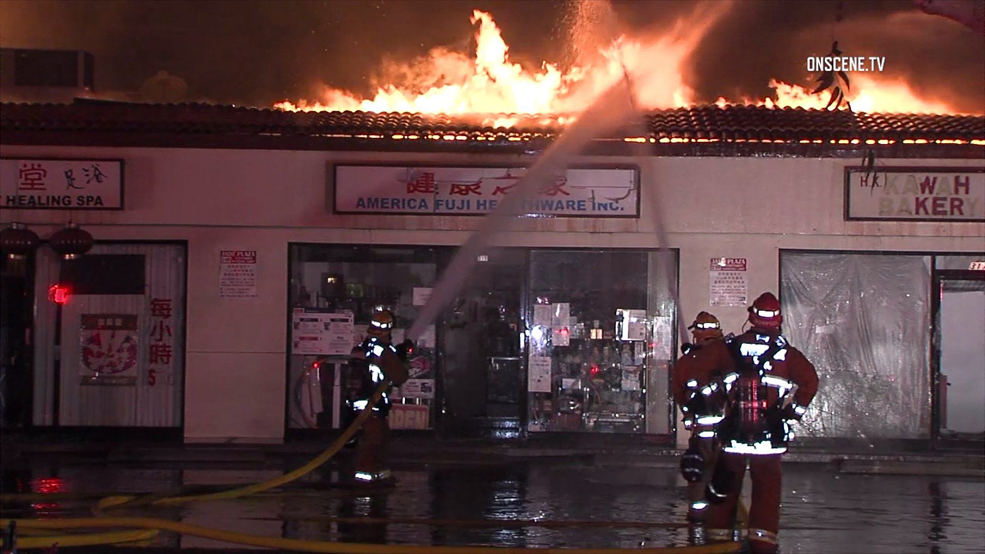 Firefighters battle a blaze at a strip mall in Monterey Park on Dec. 15, 2016. (Credit: OnScene.TV)