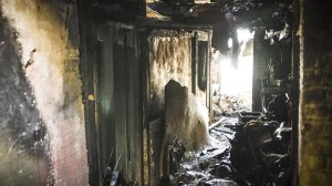 Debris inside a warehouse where a fire killed at least 24 people during a club-style party. (Credit: David Butow / Los Angeles Times)