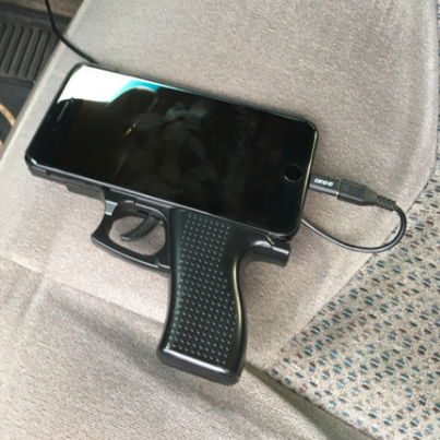 Sleeping Man in Car With Gun Shaped Cell Phone Case Prompts Police