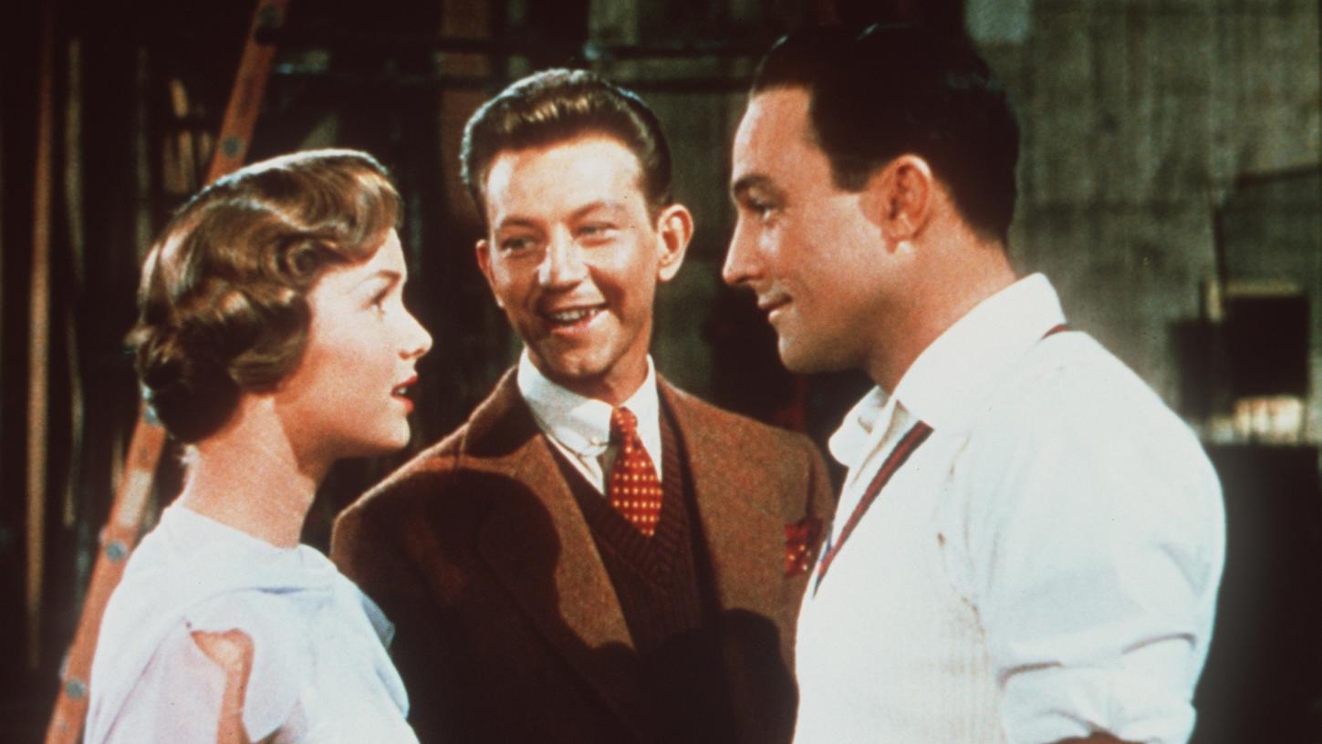 Debbie Reynolds, left, Donald O'Connor and Gene Kelly star in the 1952 hit musical "Singin' in the Rain." (Credit: Warner Bros. via Los Angeles Times)