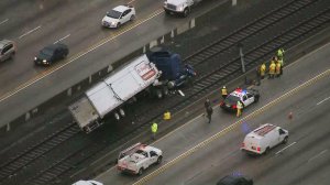 A big rig landed on the Gold Line tracks in Pasadena on Dec. 22, 2016. (Credit: KTLA)