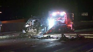 A vehicle is towed away following a fatal crash in Pacoima on Jan. 26, 2017. (Credit: KTLA)