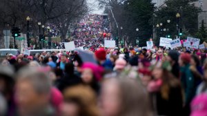 Demonstrators march on the National Mall in Washington, DC, for the Women's march on Jan. 21, 2017. (Credit: Jim Watson/AFP/Getty Images)