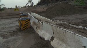 Mud cakes a street in Duarte on Jan. 22, 2017 after heavy rain pounded the Fish Fire burn area. (Credit: KTLA)