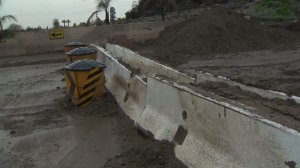 Mud cakes a street in Duarte on Jan. 22, 2017 after heavy rain pounded the Fish Fire burn area. (Credit: KTLA) 