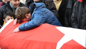 Relatives and friends mourn at a coffin during the funeral of Ayhan Arik, one of the 39 victims of the gun attack on the Reina, a popular night club in Istanbul near by the Bosphorus shores, in Istanbul, January 1, 2017, Turkey. (Credit: Burak Kara/Getty Images)