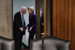 Senate Armed Services Committee Chairman John McCain (R-AZ), left, talks with Sen. Elizabeth Warren (D-MA) before a hearing with the Director of National Intelligence and National Security Agency chief on Capitol Hill Jan. 5, 2017. (Credit: Chip Somodevilla / Getty Images)