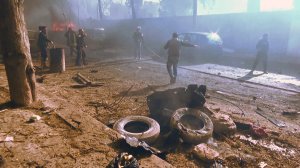 An image grab taken from an AFPTV video released on Jan. 7, 2017, shows people gathering amidst debris at the site of a car bomb attack in the rebel-held town of Azaz in northern Syria. (Credit: Stringer / AFP / Getty Images)