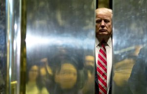 US President-elect Donald Trump boards the elevator after escorting Martin Luther King III to the lobby after meetings at Trump Tower in New York City on January 16, 2017. (Credit: DOMINICK REUTER/AFP/Getty Images)