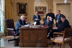 President Donald Trump speaks on the phone with Russian President Vladimir Putin in the Oval Office of the White House, Jan. 28, 2017 in Washington, DC. Also pictured, from left, White House Chief of Staff Reince Priebus, Vice President Mike Pence, White House Chief Strategist Steve Bannon, Press Secretary Sean Spicer and National Security Advisor Michael Flynn. France and Australia. (Credit: Drew Angerer/Getty Images)