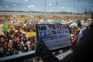 Protesters gather at JFK International Airport against Donald Trump's executive order on January 28, 2017 in New York. (Credit: Bryan R. Smith/AFP/Getty Images)