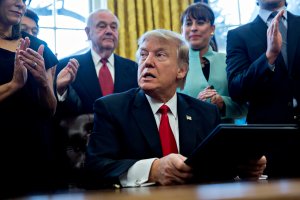 U.S. President Donald Trump pauses after signing an executive order in the Oval Office of the White House surrounded by small business leadersJanuary 30, 2017 in Washington, DC. (Credit: Andrew Harrer - Pool/Getty Images)