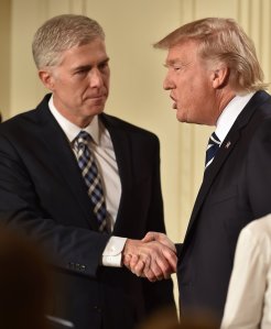 U.S. Circuit Judge Neil Gorsuch shakes hands with President Donald Trump after he was nominated for the Supreme Court, at the White House in Washington, D.C., on Jan. 31, 2017. (Credit: NICHOLAS KAMM/AFP/Getty Images)