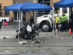 A Pomona officer's motorcycle remains at the scene where it collided with an SUV on Jan. 10, 2017. (Credit: Ellina Abovian / KTLA)