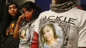 Jacqueline Hernandez's mother, Sandra Hernandez, center, and father, Ruben Vicente, right, wear T-shirts with Jacqueline's picture during a morning press conference with family friend, Rhina Calderon, left, at LAPD headquarters on Jan. 13, 2017. (Credit: Mark Boster / Los Angeles Times)