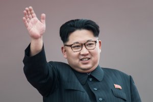 North Korean leader Kim Jong-Un waves from a balcony of the Grand People's Study House following a mass parade marking the end of the 7th Workers Party Congress in Kim Il-Sung Square in Pyongyang on May 10, 2016. (Credit: Ed Jones/AFP/Getty Images)