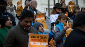 Protesters take part in a vigil at Los Angeles City Hall Jan. 25, 2017, against President Trump's executive orders on immigration. (Credit: Gina Ferazzi / Los Angeles Times)