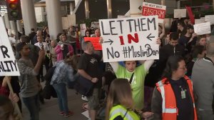 Demonstrators gather outside of the Tom Bradley terminal of LAX to show solidarity with people from Muslim-majority counties being detained at U.S. airports on Jan. 28, 2017. (Credit: KTLA) 