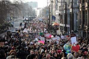 Protesters make their way through the streets of London during the Women's March on January 21, 2017 in London, England. (Credit: Dan Kitwood/Getty Images)