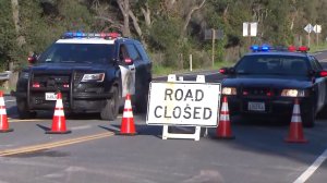 CHP officers man the closure of Ortega Highway near San Juan Capistrano on Jan. 26, 2017. (Credit: KTLA)