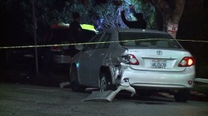 Two men attempting to flee a shooting in Pasadena on Jan. 7, 2017, apparently crashed their car after being shot, and one died. (Credit: KTLA)