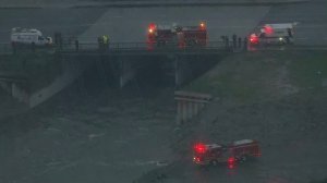 A rescue helicopter searches the Dominguez Channel in Gardena after a man was reported missing in the water amid heavy rain on Jan. 8, 2017. (Credit: KTLA)