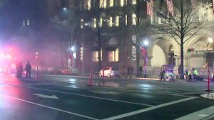 A man was hospitalized after authorities say he started a fire outside of the Trump International Hotel in Washington D.C. on Jan. 17, 2017. (Credit: WJLA via CNN)