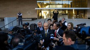 Former Los Angeles County Sheriff Lee Baca, center, talks to reporters outside court in December. (Credit: Marcus Yam/Los Angeles Times)