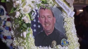 Officer Keith Boyer is shown in a photo displayed at a vigil for him outside the Whittier Police Department on Feb. 20, 2017. (Credit: KTLA)