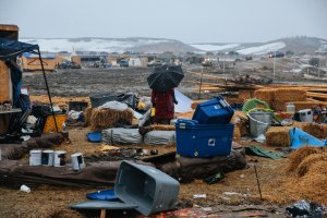 Campers prepare for the Army Corp's 2pm deadline to leave the Oceti Sakowin protest camp on February 22, 2017 in Cannon Ball, North Dakota. Activists and protesters have occupied the Standing Rock Sioux reservation for months in opposition to the completion of the Dakota Access Pipeline. (Credit: Stephen Yang/Getty Images)