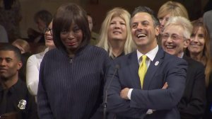 Gayle Anderson tears up next to Councilman Joe Buscaino after he presented her with a proclamation declaring "Gayle Anderson Day" at L.A. City Hall on Feb. 28, 2017. (Credit: KTLA)