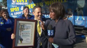 Councilman Joe Buscaino presents a proclamation to Gayle Anderson for "Gayle Anderson Day" on Feb. 28, 2017. (Credit: KTLA)